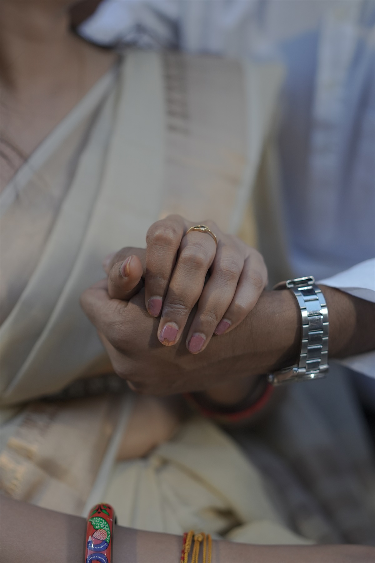 Hands held, with the ring