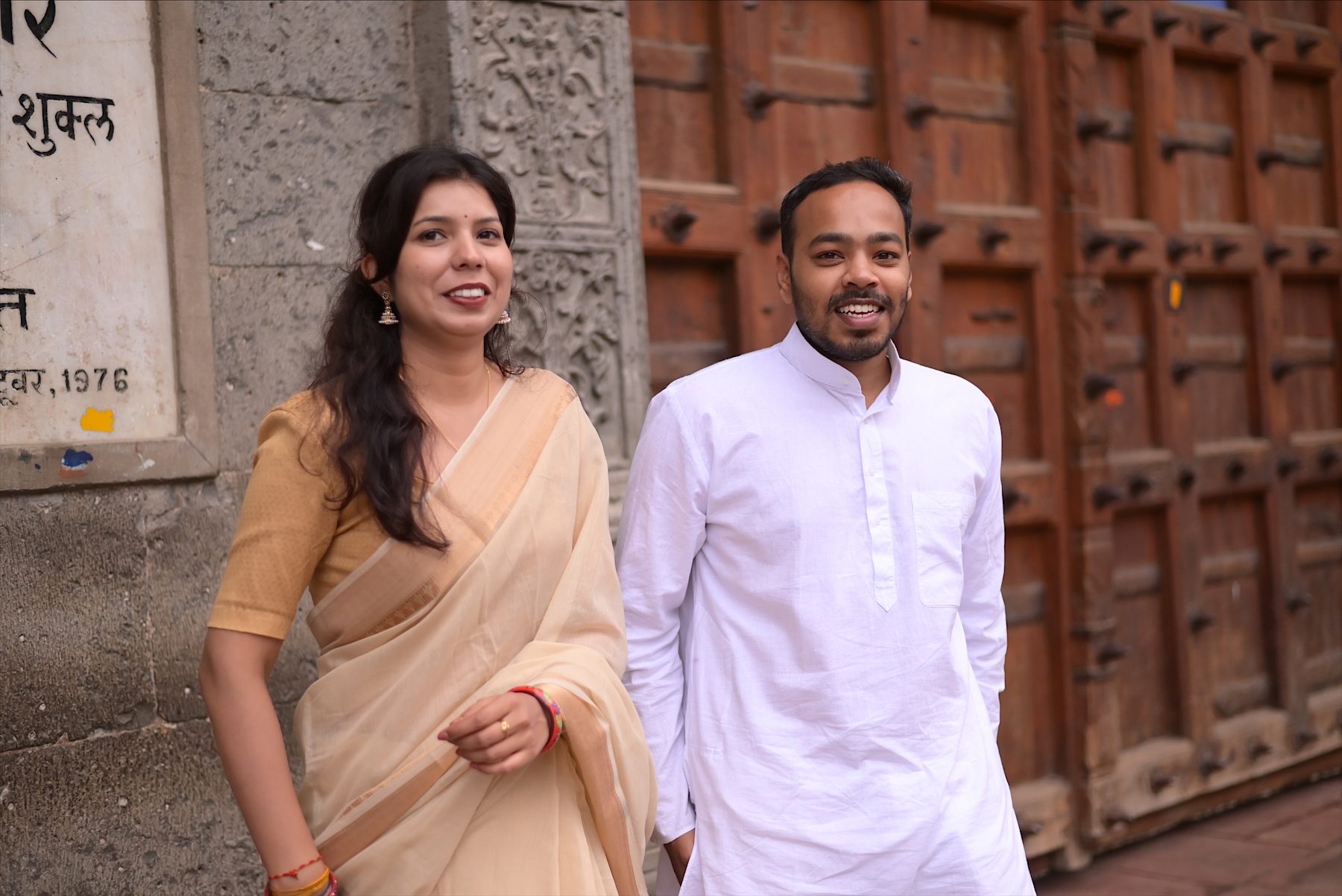Smiling together at the Rajwada door