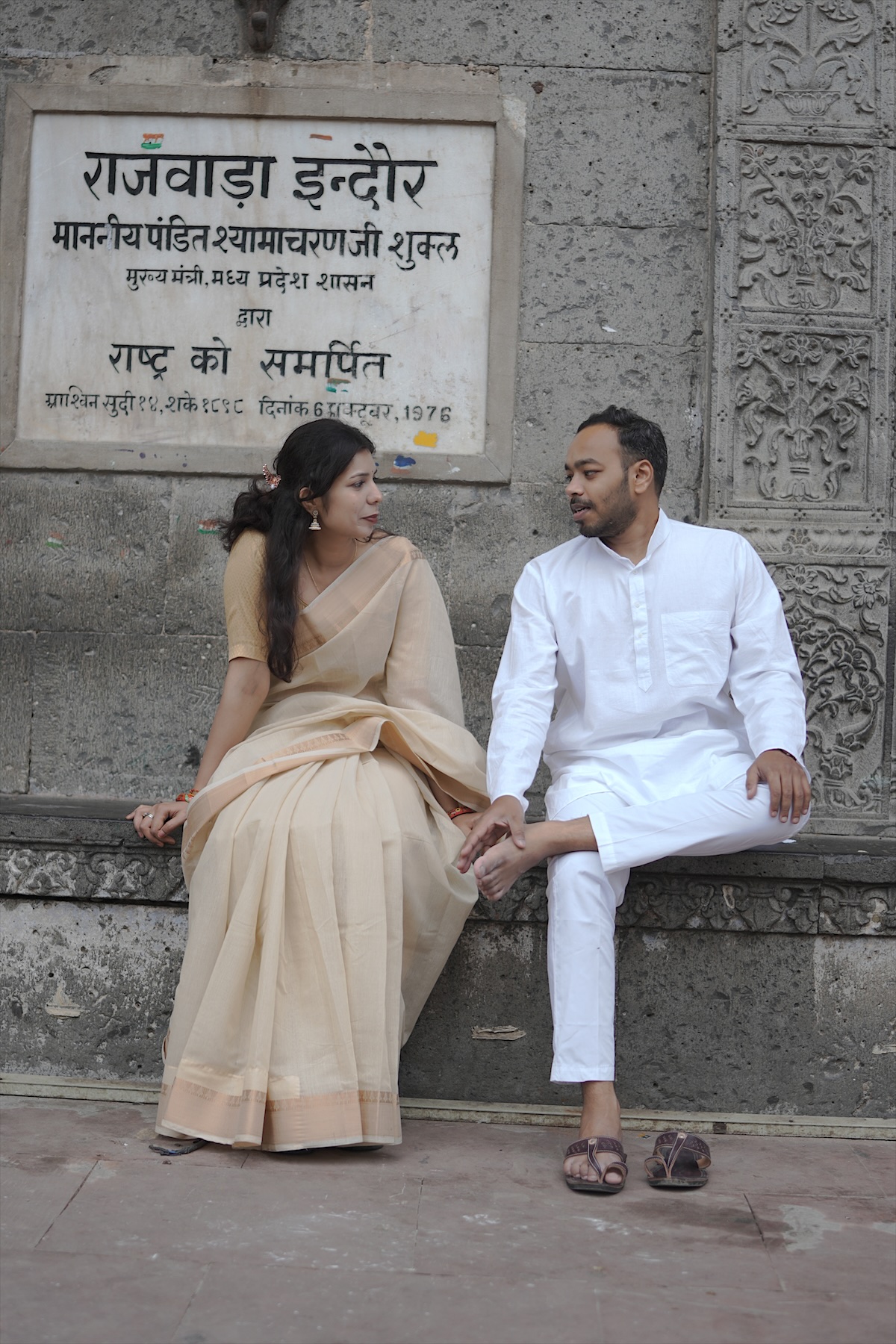 Under the Rajwada sign
