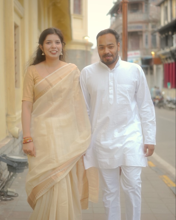 Walking hand in hand down an old Indore street